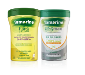 Embalagem segurada por uma mão do produto Tamarine Fibras em pó, contendo 250g. Com uma ilustração de folha atrás da embalagem.