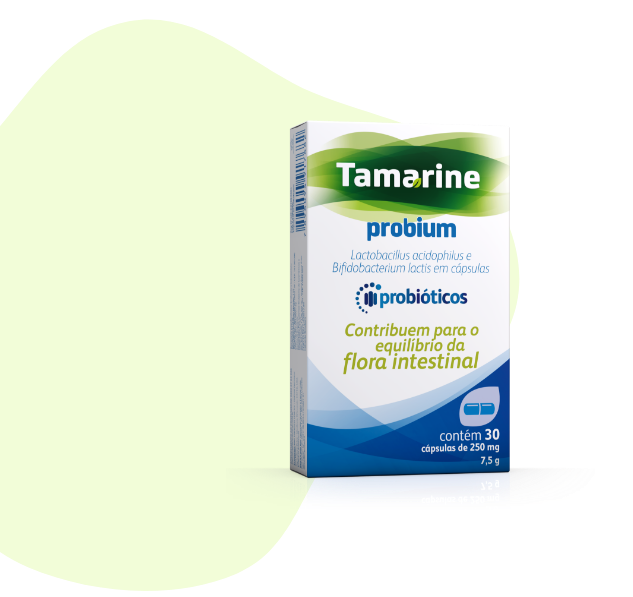 Foto da embalagem do produto Tamarine Probium, com um formato verde claro abstrato no fundo.